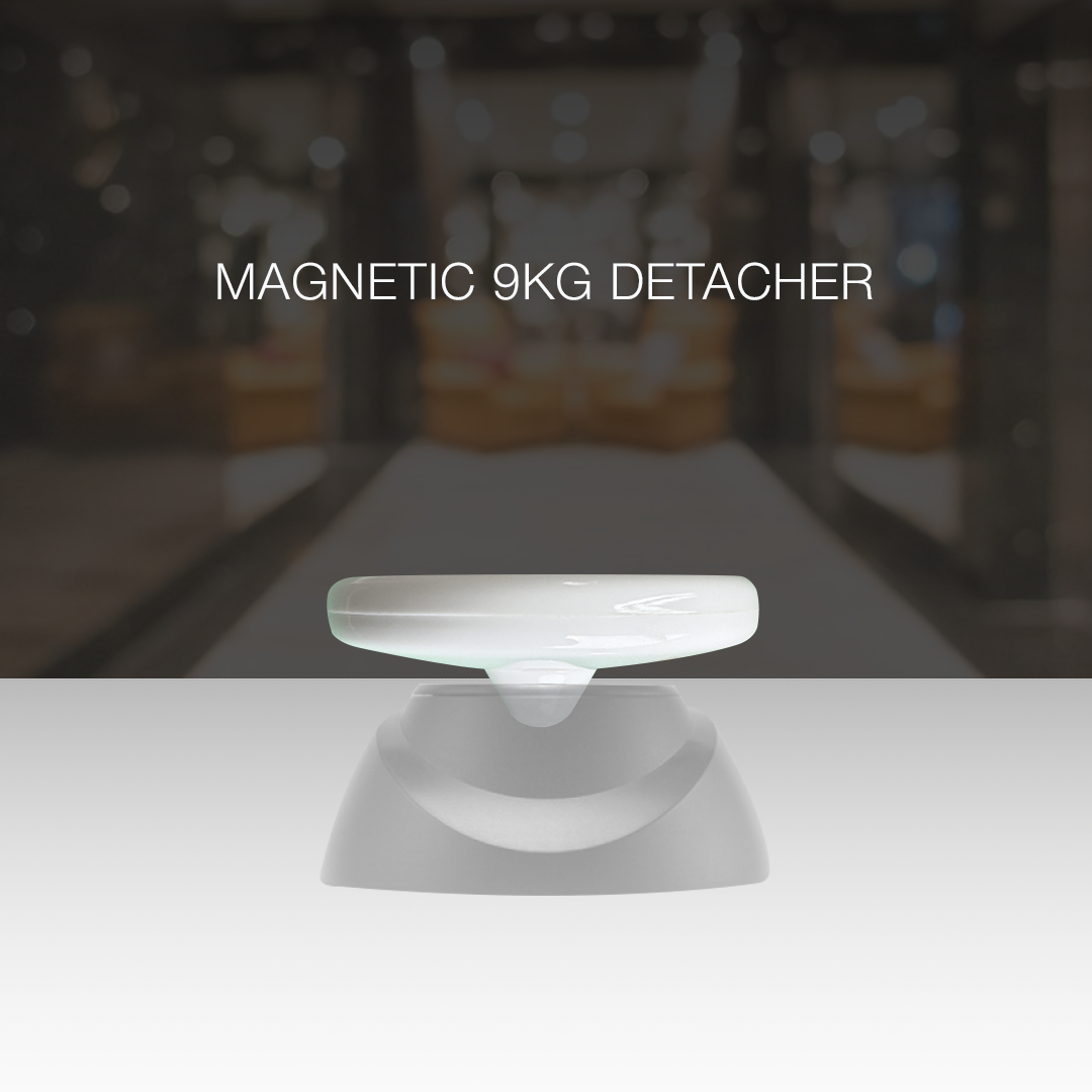 Saucer Ink Security Tag shown with a detacher for secure and easy removal after purchase.