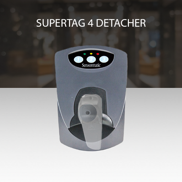 Top view of Supertag 4 Power Sensormatic Detacher in action, removing a security tag efficiently.