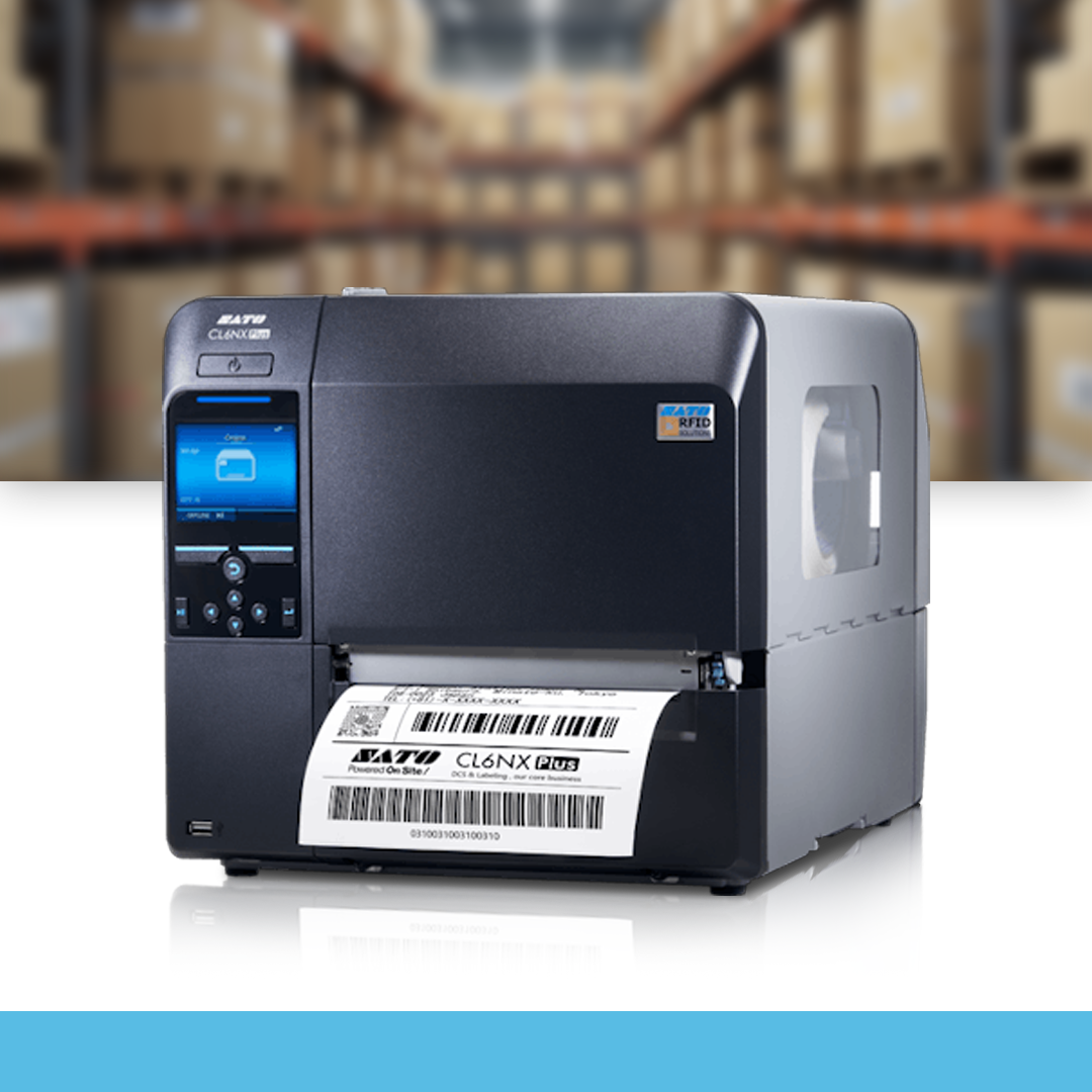 SATO CL6NX Plus 203 dpi industrial thermal label printer on table in warehouse environment