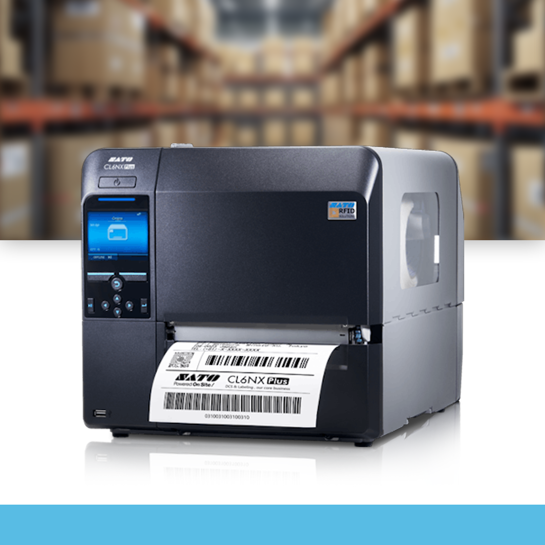 SATO CL6NX Plus 305 dpi industrial thermal label printer on table in warehouse environment