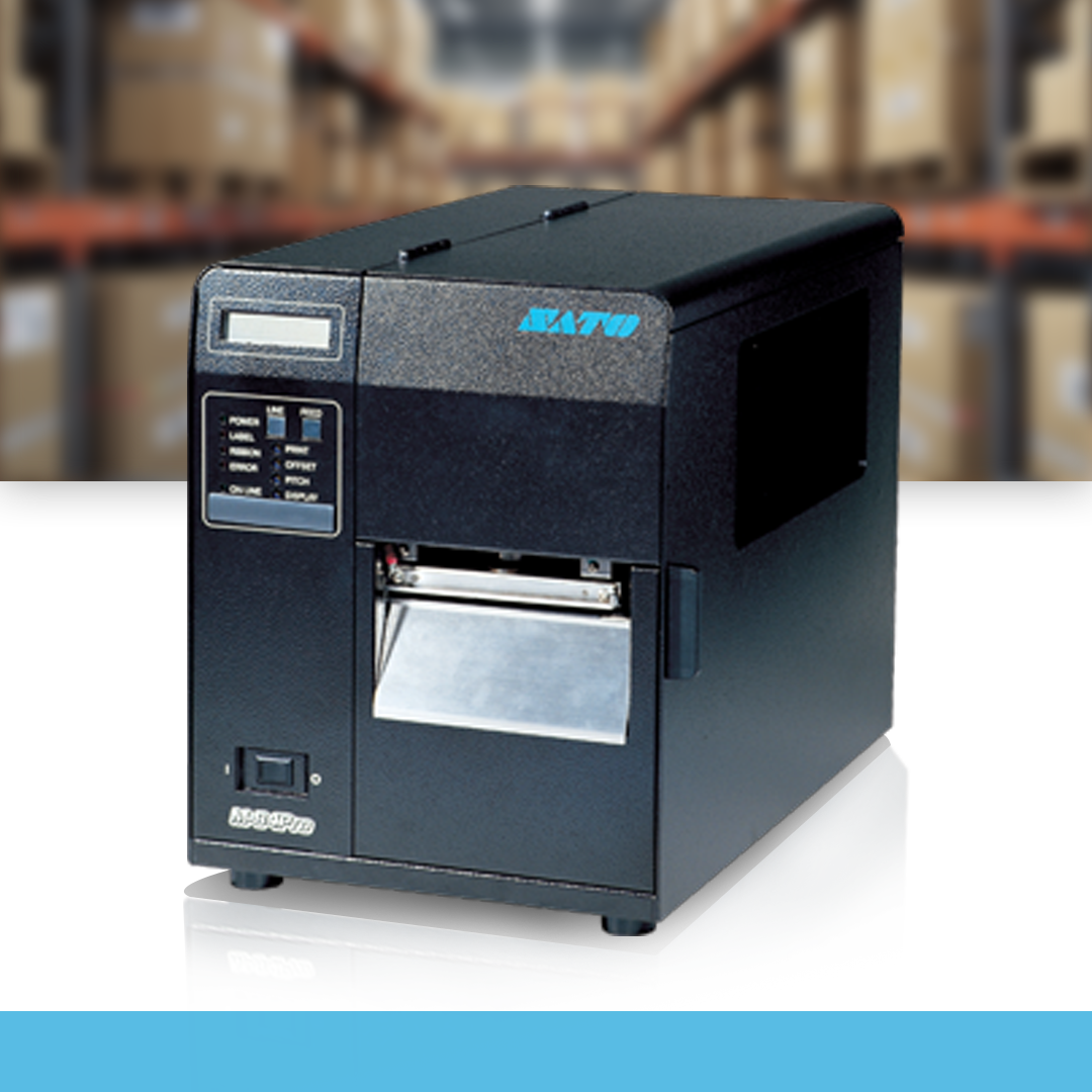 SATO M84Pro 305 dpi thermal label printer in workplace environment on table with warehouse background